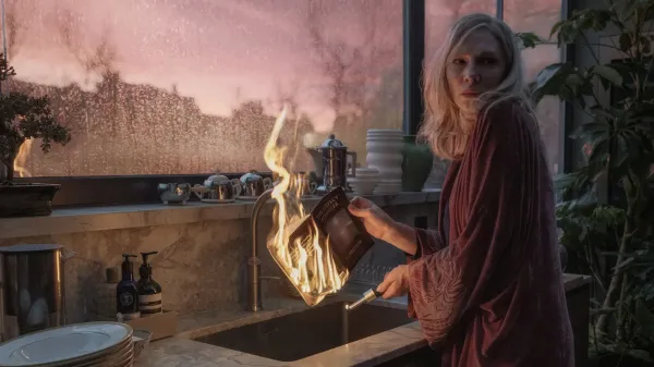 Cate Blanchett burning a book in a still from Disclaimer