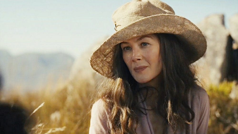 A still from the new season of Wheel of Time, showing actress Rosamund Pike in a very out of place, like, fancy garden hat or something