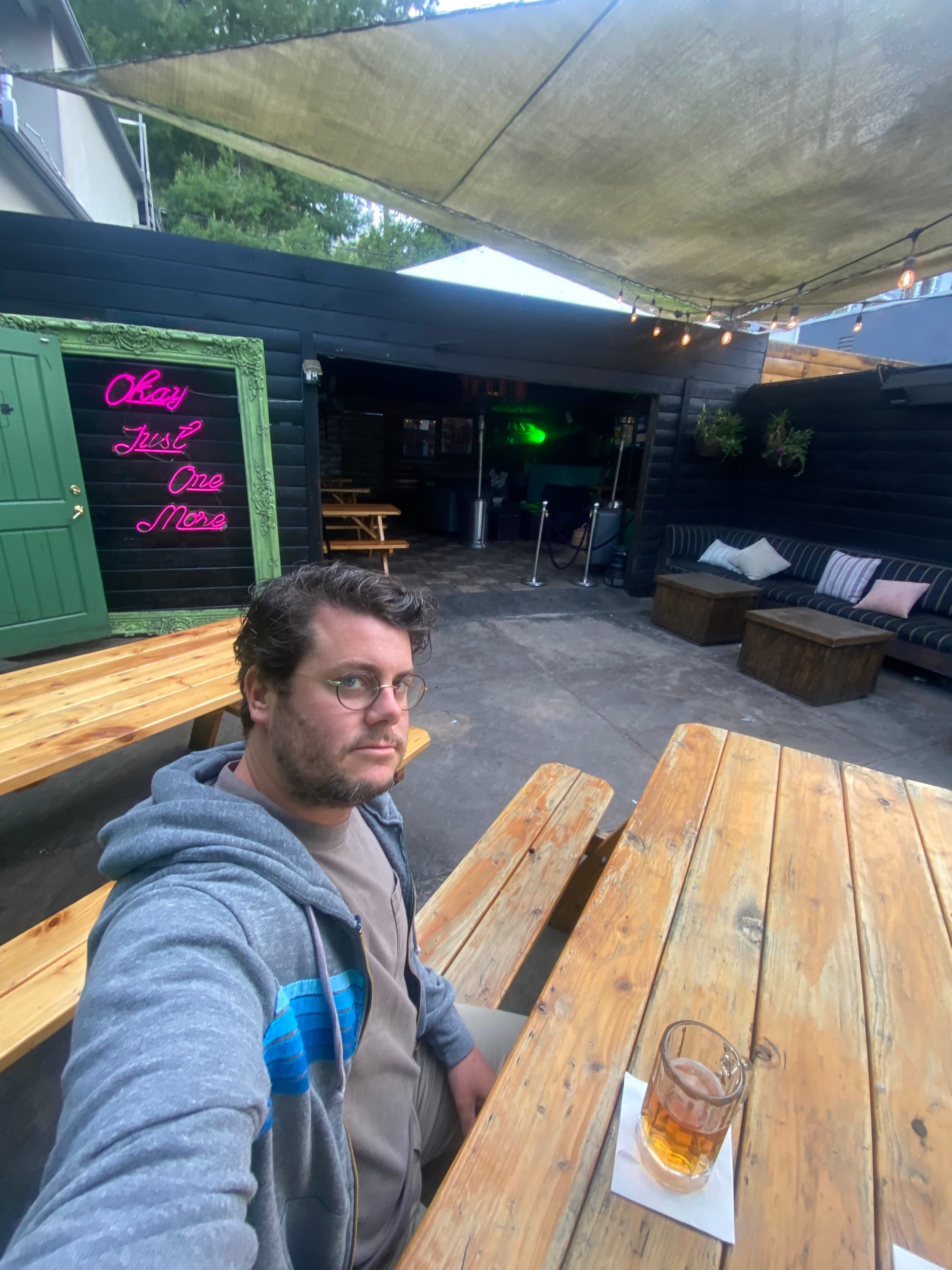 A selfie of me all alone at Jax's tragically sad bar, where I am literally the only person